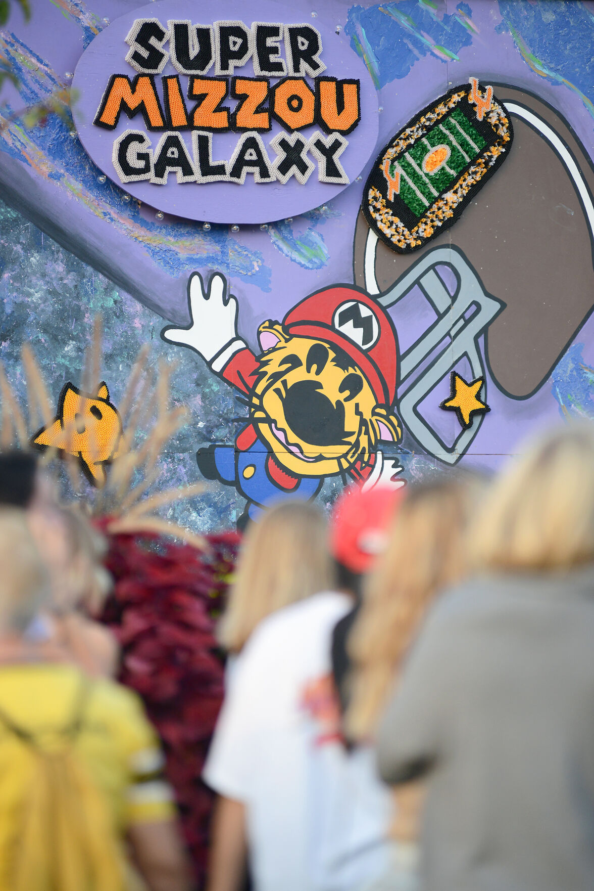 Families and students spectate the Pi Beta Phi and Phi Delta Theta’s Super Mario Galaxy deck